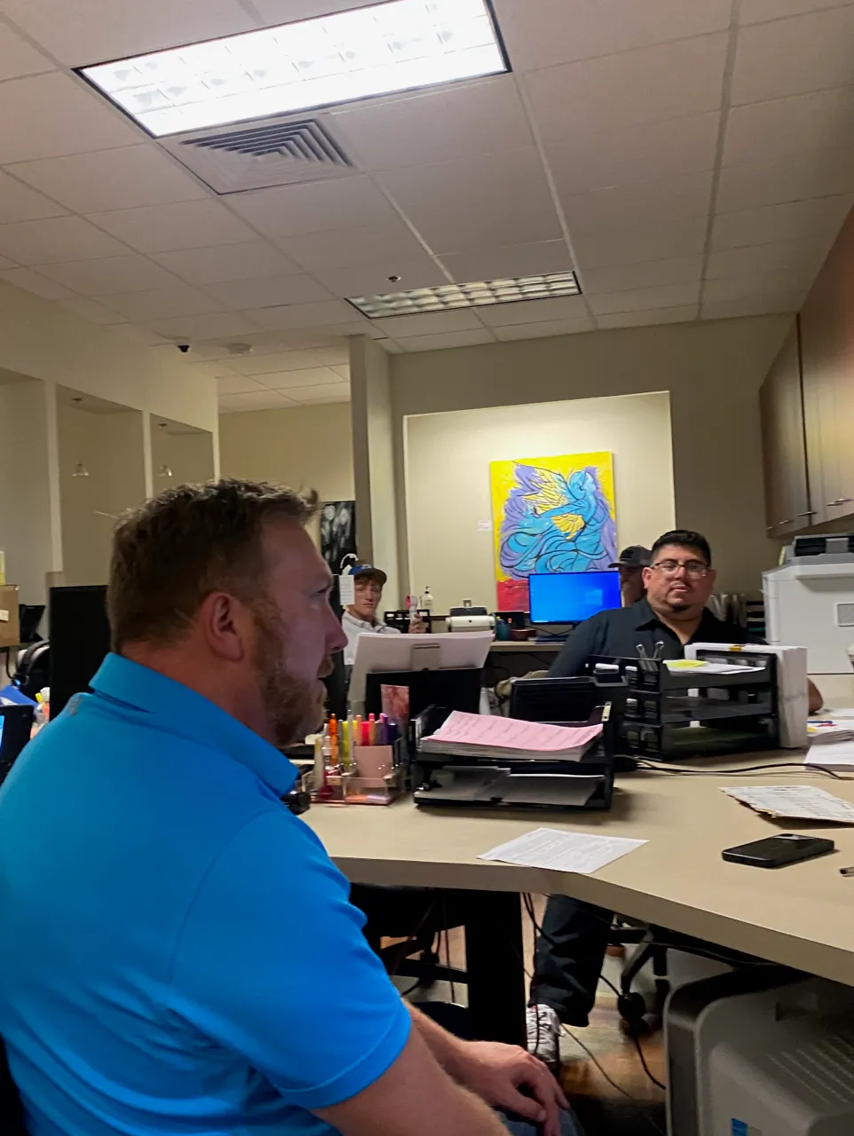 Evolution Technologies technicians collaborating at the office